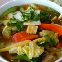Large Hanoi Veggie Noodle Soup-Pho Chay · topped with vegetables and tofu.
