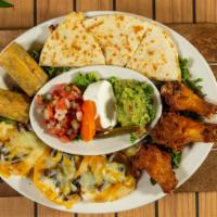 Sampler Platter
 · Combination of chicken wings, steak nachos, chicken quesadilla, and beef taquito. Served wit...