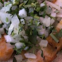 Fish Tacos
 · Broiled tortilla crusted tilapia served soft flour tortilla. Served with Mexican rice, refri...
