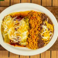 Shredded Chicken Enchiladas
 · Served with green tomatillo sauce. Two corn tortillas rolled with preference, topped with sa...