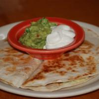 Quezadilla · A grilled flour tortilla stuffed with melted cheese, diced jalapeño peppers, served with gua...