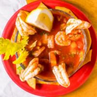 Coctel De Camarones · Our Salvadoran style shrimp cocktail with minced shrimp, marinated in tomato juice, cilantro...