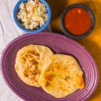 Pupusa · Served with our homemade pickled shredded cabbage and carrots.