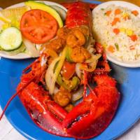 Langosta Rellena / Stuffed Lobster · Delicious sauteed lobster stuffed with our homemade crab and shrimp blend.  Served with rice...