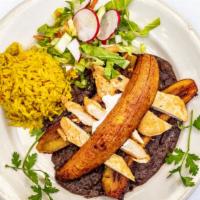 El Cubano · Whole grilled plantain over black refried beans topped with grilled chicken fajita served wi...