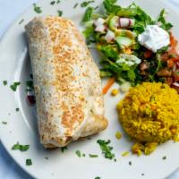 Texas Burrito · Choice of chicken or beef fajita marinated with southwest spices, packed with lettuce, chedd...