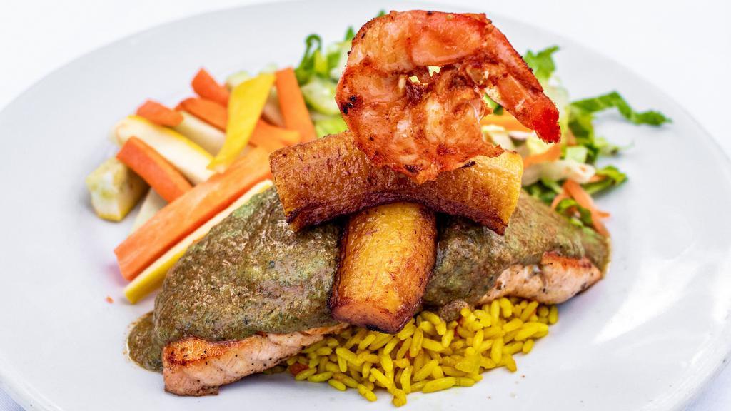 Conquistador · Fresh Atlantic fileted salmon marinated with tomatoes basil sauce, topped with a jumbo shrimp and plantain, served with fruit, and rice.