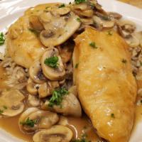 Chicken Marsala · Pan seared chicken smothered in a rich mushroom and garlic Marsala wine sauce with rice and ...