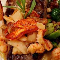Surf And Turf · 8 oz. choice Angus New York strip, cast iron seared, smothered by shrimp and scallops, in a ...