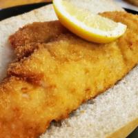 Fried Haddock Sandwich Dinner · 6 oz. of fresh haddock served on a long roll with lemon and house tartar.