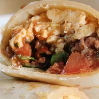  Breakfast Burrito · Two scrambled eggs, your choice of one protein option, rice, refried pinto beans, onion, cil...