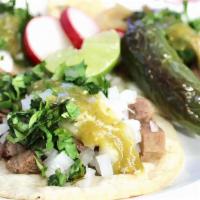  Three Lengua (Tongue) Tacos · Three tacos de lengua, onion, cilantro, with salsa.(our tacos are served with chips with bea...
