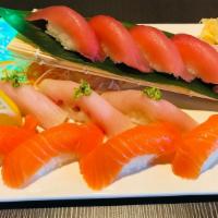 Tri-Color Sushi Combo Dinner · 4 pieces of tuna sushi, 4 pieces of salmon sushi, 4 pieces of  yellowtail sushi.