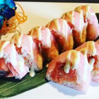 Sex On The Beach · Spicy crunch tuna, spicy crunch salmon and cucumber inside wrapped with pink soy paper and w...