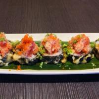 Volcano Roll · White fish and crabmeat inside deep fried topped with spicy tuna ball fish egg, scallion and...