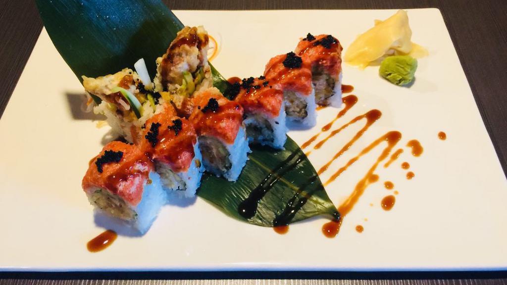Fall River Roll · Deep fried soft shell crab and cucumber inside, topped with spicy crunch tuna and black fish egg, eel sauce.