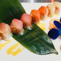 Fantastic Roll · Spicy crunch white tuna wrapped with soy paper topped with tuna, salmon, yellowtail, flake w...
