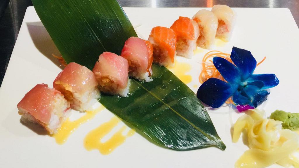 Fantastic Roll · Spicy crunch white tuna wrapped with soy paper topped with tuna, salmon, yellowtail, flake with honey miso sauce.
