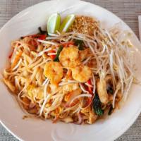 Pad Thai · Thin, flat rice noodles stir-fried chicken, shrimp, egg, bean sprouts, and Thai basil with s...