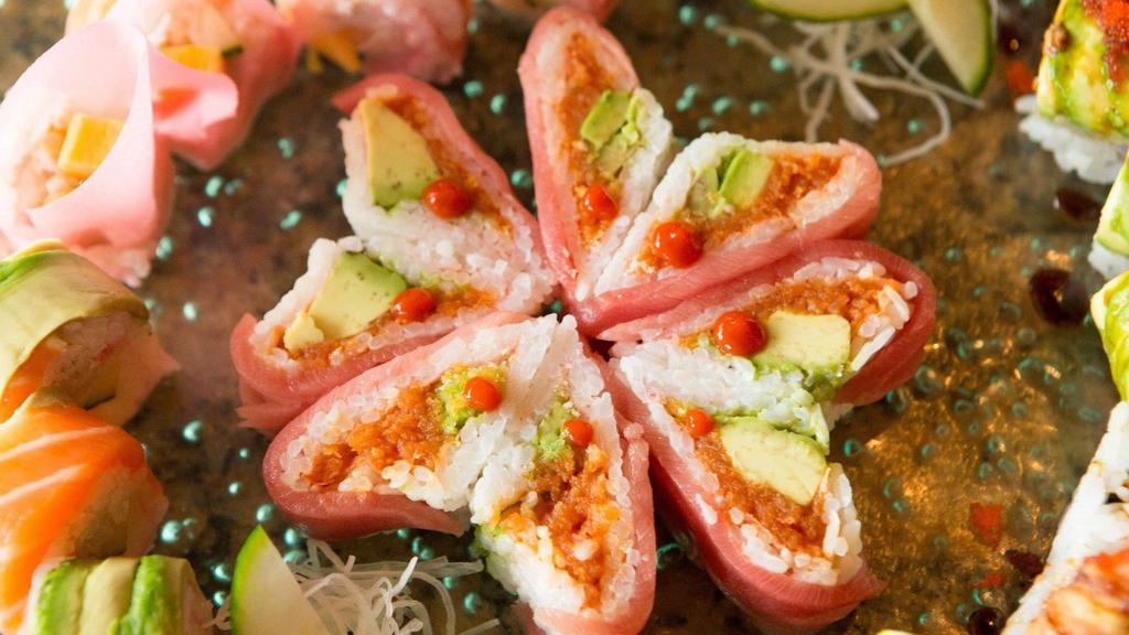 Heart Of Bowie Roll · Spicy tuna, avocado, tempura flakes rolled with soy paper, and wrapped with tuna.