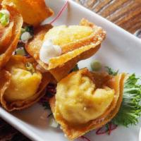 Crab & Cheese Wontons · Cream cheese filling, sweet and sour dip.