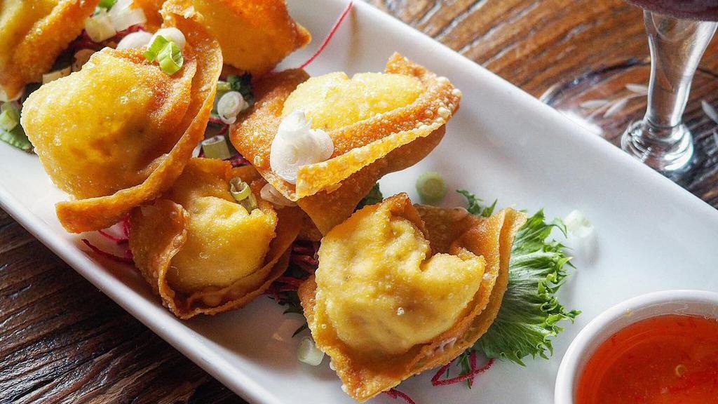 Crab & Cheese Wontons · Cream cheese filling, sweet and sour dip.