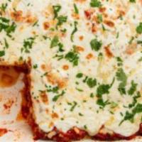 Eggplant Parmesan · Breaded eggplant topped with marinara sauce and melted mozzarella cheese.