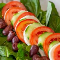 Caprese Salad · mixed greens, fresh mozzarella, roma tomatoes, cucumbers, Kalamata olives and basil. Served ...