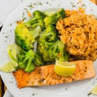 Grilled Salmon · Blackened or lemon pepper salmon grilled to perfection. Served with dirty rice or steamed ri...