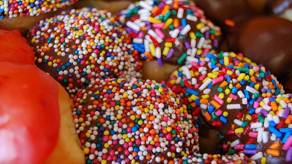 1 Dz Sprinkle Holes · 1 dz chocolate glazed and sprinkle topped donut holes.