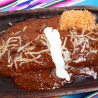 Burrito Azabache · Shredded brisket simmered in guajillo, tomatoes, and crushed chile de Arbol peppers (very sp...