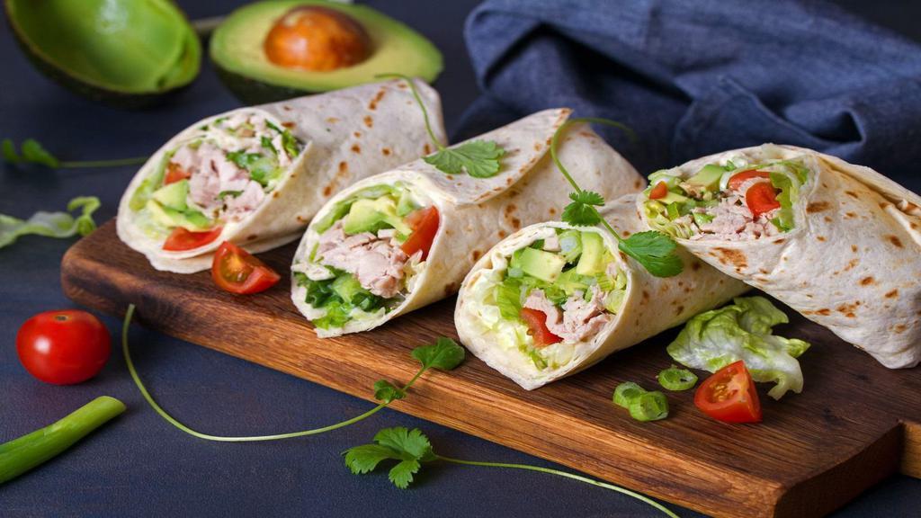 Titanic Wrap · Grilled lemon chicken, mozzarella cheese, avocado, lettuce, tomatoes and chipotle mayo all wrapped up in a tortilla.