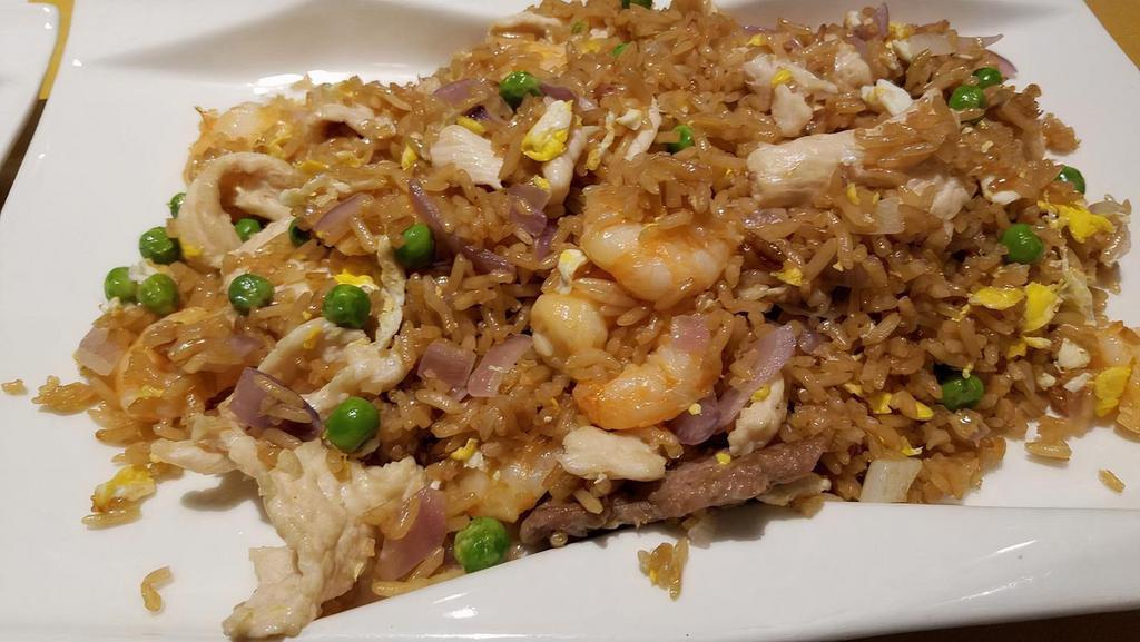 Fried Rice · Served with fried rice and egg roll or soda.