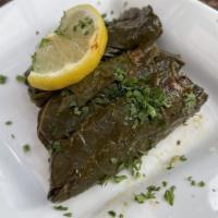 Vine Leaves · Grape leaves stuffed with rice, parsley, pomegranate molasses cooked in olive oil.