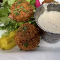Falafel · Chick peas with parsley, onions and coriander deep fried. Served with tahini.