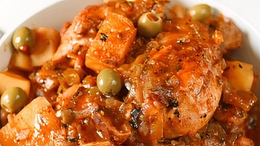 Fricassee Chicken · Chicken stewed in a flavorful tomato sauce.