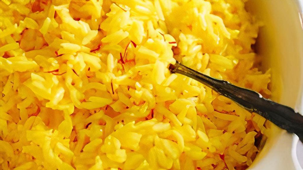 Yellow Rice · Non-spicy rice simmered in special Caribbean seasonings.