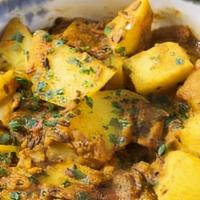 Curry Potatoes · Slowly cooked potatoes in curry sauce for the spice to develop.