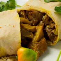 Roti Goat · Curried goat wrapped in a roti.