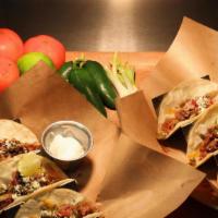 Spicy Pulled Pork Tacos (3) · Three  smoked pork tacos with grilled onion and jalapeno, cheese, queso fresco, cilantro, an...