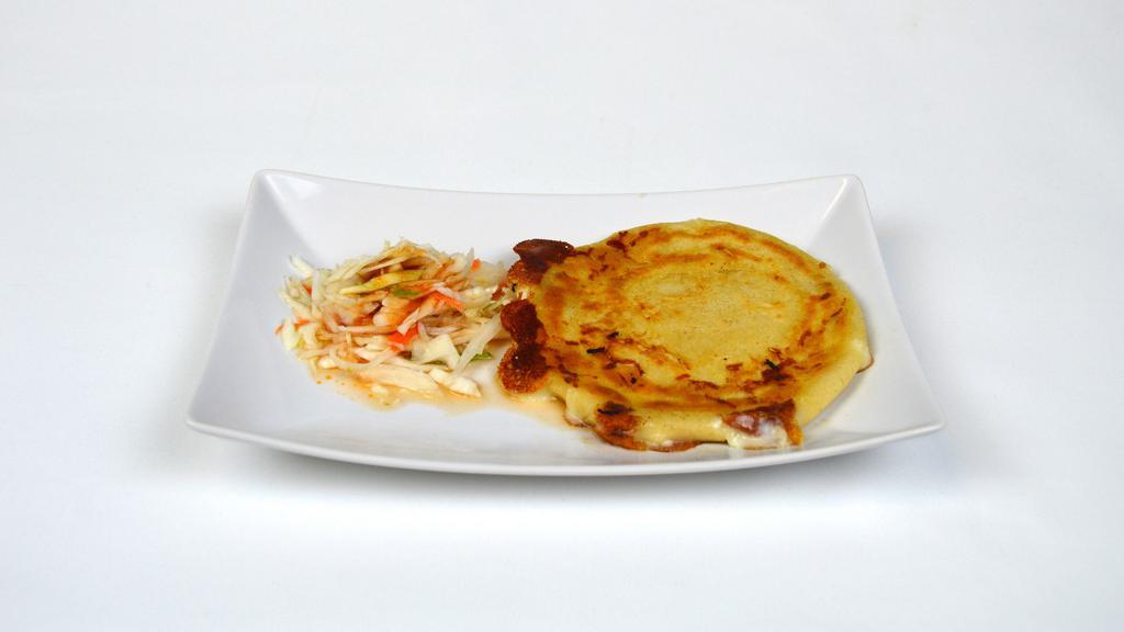 Pupusas De Queso · Small grilled tortilla stuffed with cheese.