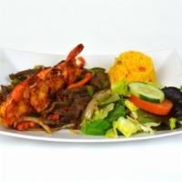 Carne Y Camaron Plato · Grilled steak strips and four jumbo shrimp with grilled peppers and onions.