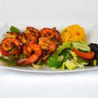 Camaron Plato · Seven grilled jumbo shrimp with grilled peppers and onions.