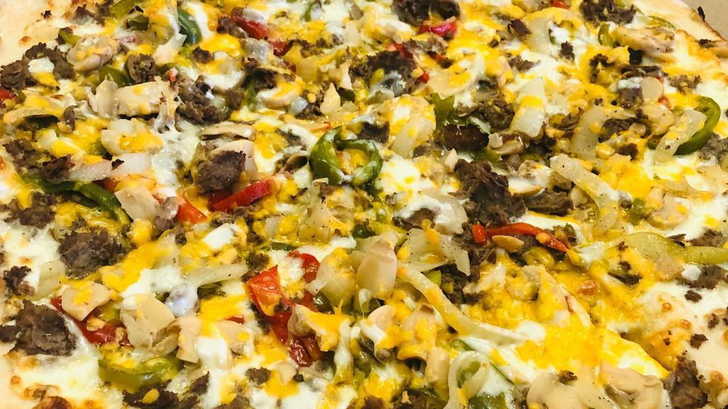 Cheesesteak Pizza · Philly cheesesteak on pizza with choice of peppers, onions & mushrooms.