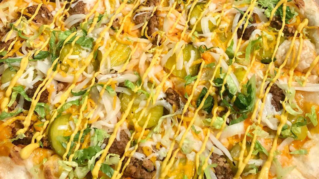 Vegan Big Burger Pizza · Vegan Meatballs, Vegan Mozzarella, Vegan Cheddar, Pickles, Onions, Lettuce, Mustard & Vegan Special Sauce.