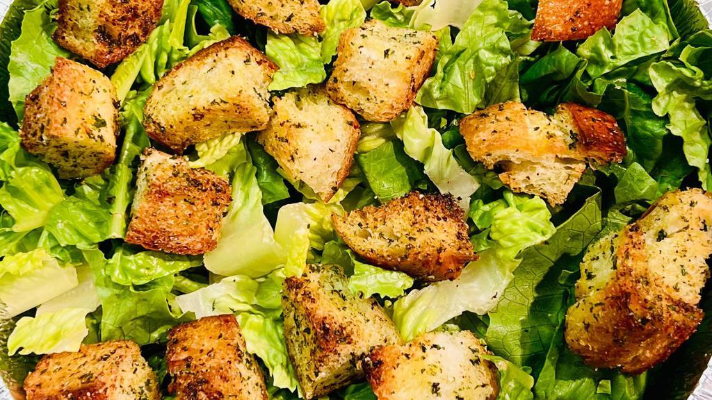Vegan Caesar Salad · Romaine Lettuce with our Homemade Vegan Crutons and Vegan Caesar on the side.