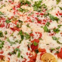Vegan Margherita Pizza (Round) · Vegan Mozzarella, Margherita Sauce & Basil on a round pizza crust.