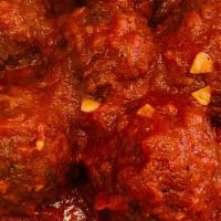 Vegan Meatballs · Five Vegan Meatballs with Marinara Sauce.