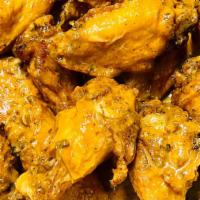 Buffalo Wings · Seasoned Traditional Wings tossed in choice of Sauce.