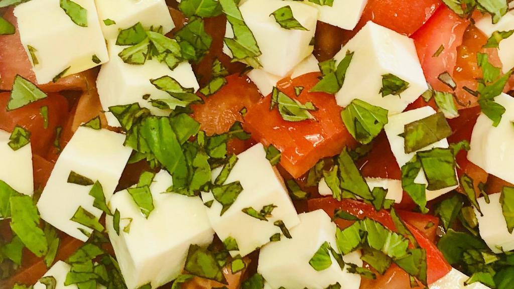 Tomato, Fresh Mozz & Basil Salad · Chopped tomato salad with fresh mozzarella, basil and olive oil.